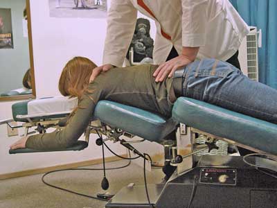 Dr. Markos applying the Flexion-Distraction Technique